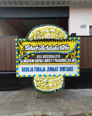Papan Bunga Duka di Tinada